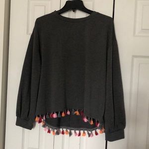 Women’s sweater with pom poms